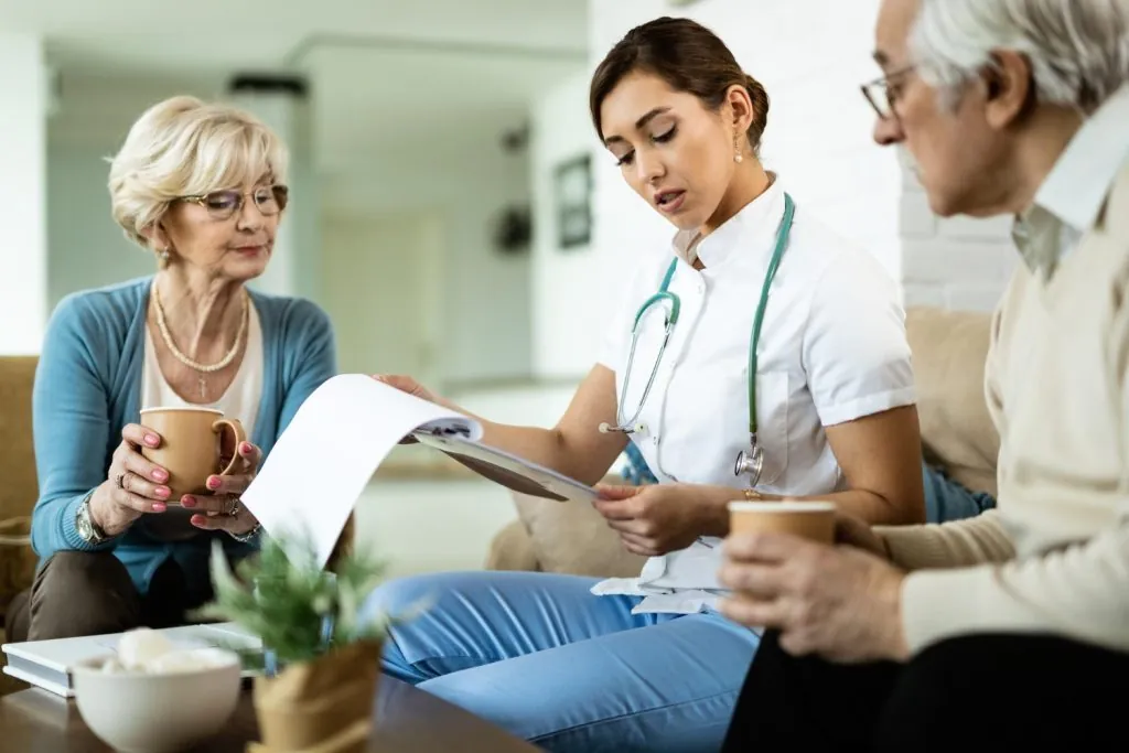 Healthcare professional speaking Swedish with a patient